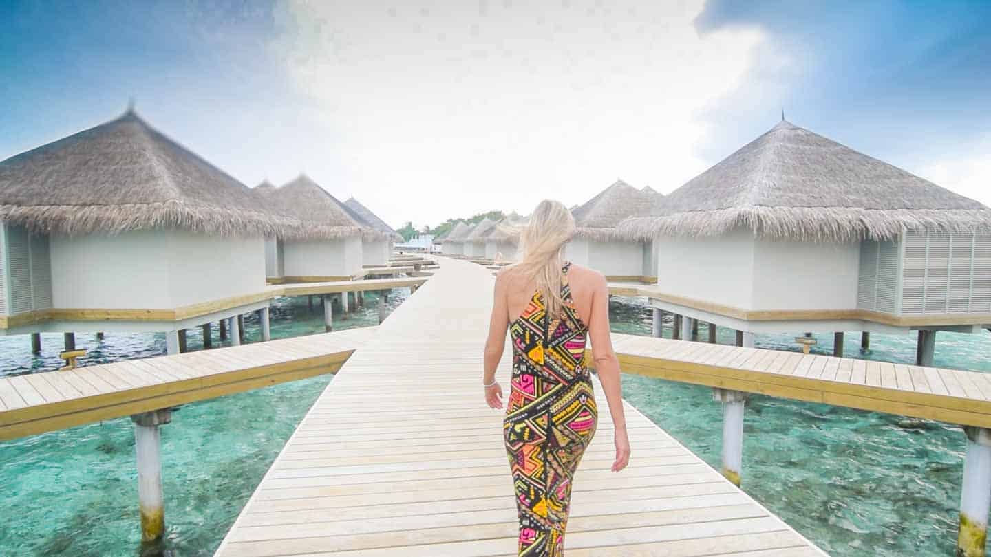 Hannah walking to Overwater bungalows at Cinnamon Dhonveli Maldives ...