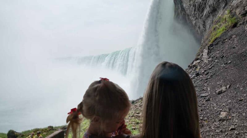 Mom and Daugther looking at Niagara Falls at the Journey Behind the Falls attraction